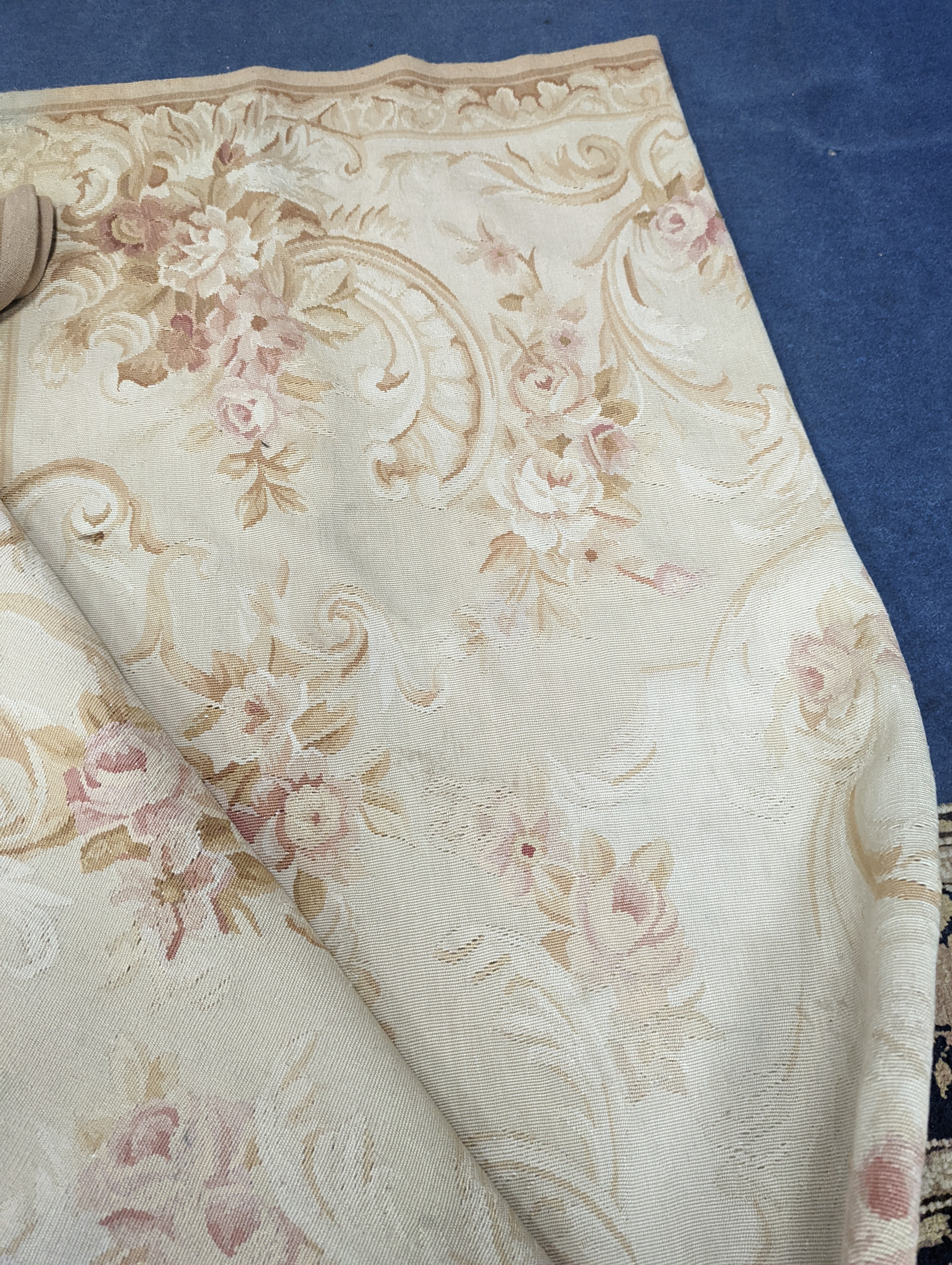 An Aubusson gold ground rug with rose pattern, 244 x 153cm